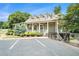 Lovely clubhouse featuring dormer windows, covered entry and elegant landscaping at 265 Lee River Cv, Suwanee, GA 30024