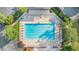 Aerial view showcasing a well-maintained community pool with surrounding lounge chairs and landscaping at 265 Lee River Cv, Suwanee, GA 30024