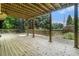 Inviting covered deck offers a perfect spot for outdoor dining and relaxation with beautiful backyard view at 265 Lee River Cv, Suwanee, GA 30024