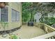 Exterior view of a deck with a grill, offering an inviting space for outdoor entertaining and relaxation at 265 Lee River Cv, Suwanee, GA 30024