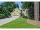Charming two-story home with an attached two car garage and a well-manicured front lawn at 265 Lee River Cv, Suwanee, GA 30024