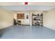 Spacious garage with ample room for parking, storage, and workspace, with convenient shelving units at 265 Lee River Cv, Suwanee, GA 30024