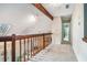 Hallway with skylights and wooden railing offers plenty of natural light at 265 Lee River Cv, Suwanee, GA 30024