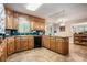 A kitchen with tile floors, ample counter space, and modern appliances at 265 Lee River Cv, Suwanee, GA 30024