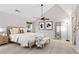 Spacious bedroom featuring a ceiling fan, bench, and decor at 3007 Manning Dr, Marietta, GA 30062