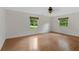 Bedroom with hardwood floors and bright, airy windows offers comfortable and stylish living at 3007 Manning Dr, Marietta, GA 30062