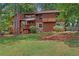 Well-maintained two-story house with a combination wood and stone exterior and landscaped yard at 3007 Manning Dr, Marietta, GA 30062