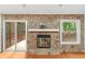 Cozy fireplace with stone surround and access to the porch at 3007 Manning Dr, Marietta, GA 30062