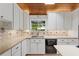 Kitchen showcasing stone countertops, stainless steel dishwasher and tile backsplash at 3007 Manning Dr, Marietta, GA 30062