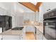 Kitchen with light countertops, gas cooktop on center island, and stainless appliances at 3007 Manning Dr, Marietta, GA 30062