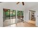 Bright sunroom with tiled floors, glass sliding doors, and access to a stone fireplace at 3007 Manning Dr, Marietta, GA 30062
