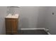 Small bathroom featuring a wood vanity with sink and toilet on a tile floor at 3086 Lone Oak Sw Ave, Atlanta, GA 30354
