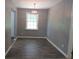 Elegant dining area with dark hardwood floors, gray walls, and eye-catching light at 3086 Lone Oak Sw Ave, Atlanta, GA 30354