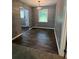 Dining room featuring hardwood floors, gray walls, a modern light fixture, and natural light at 3086 Lone Oak Sw Ave, Atlanta, GA 30354