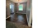 Dining space features hardwood floors, gray walls, and attractive pendant lighting at 3086 Lone Oak Sw Ave, Atlanta, GA 30354