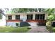 Charming single-story home featuring a brick foundation and well-maintained front yard at 3086 Lone Oak Sw Ave, Atlanta, GA 30354