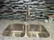 Close up of stainless steel kitchen sink with granite countertops and a contemporary faucet at 3086 Lone Oak Sw Ave, Atlanta, GA 30354