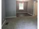 The open floor plan leads from the living room to the dining area at 3086 Lone Oak Sw Ave, Atlanta, GA 30354