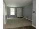Bright living room offers comfortable carpeting and fresh paint at 3086 Lone Oak Sw Ave, Atlanta, GA 30354