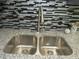 Close up of a stainless steel double sink, granite countertop and stainless steel faucet at 3086 Lone Oak Sw Ave, Atlanta, GA 30354