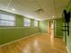 Finished basement space with hardwood floors, three windows, and fresh paint at 3195 Vickery Dr, Marietta, GA 30066