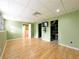 Finished basement rec room with hardwood floors, updated lighting, and storage closet at 3195 Vickery Dr, Marietta, GA 30066