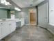 Bright bathroom featuring double vanity, large mirror, and tiled floor offering a relaxing space at 3195 Vickery Dr, Marietta, GA 30066