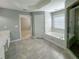 Bright bathroom featuring a soaking tub, a shower and tiled floors, perfect for relaxation and comfort at 3195 Vickery Dr, Marietta, GA 30066