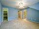 Cozy bedroom with soft carpet, ceiling fan, and access to the ensuite bathroom and closet at 3195 Vickery Dr, Marietta, GA 30066
