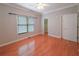 Spacious bedroom featuring hardwood floors, closet, and large window at 3195 Vickery Dr, Marietta, GA 30066