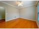 A bright bedroom features hardwood floors and a ceiling fan at 3195 Vickery Dr, Marietta, GA 30066
