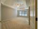 The bedroom has a tray ceiling, fan, and lots of windows at 3195 Vickery Dr, Marietta, GA 30066