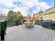 An outdoor deck area features a dining table set and grill, perfect for entertaining and outdoor relaxation at 3195 Vickery Dr, Marietta, GA 30066