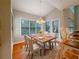 Eat-in dining area with large windows, hardwood floors, and stylish light fixture at 3195 Vickery Dr, Marietta, GA 30066