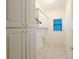 A convenient laundry room with cabinets and tile flooring at 3195 Vickery Dr, Marietta, GA 30066