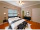 Cozy main bedroom featuring neutral colors, bench, and a modern decor at 3195 Vickery Dr, Marietta, GA 30066