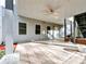 Covered patio area with tile flooring and a ceiling fan, ideal for outdoor relaxation and dining at 3195 Vickery Dr, Marietta, GA 30066