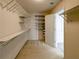 A roomy walk-in closet with shelving and door to another room at 3195 Vickery Dr, Marietta, GA 30066