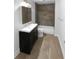 Modern bathroom with a sleek vanity, stylish tiles, and a shower with a built-in niche at 355 Marietta Hwy, Roswell, GA 30075