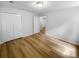 Bedroom features wood-look floors, ample closet space, and an ensuite entrance at 355 Marietta Hwy, Roswell, GA 30075
