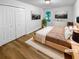 Bedroom with hardwood floors, walk-in closet, and large windows allowing lots of natural light at 355 Marietta Hwy, Roswell, GA 30075