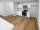Kitchen with modern stainless steel appliances, white cabinets, and hardwood floors at 355 Marietta Hwy, Roswell, GA 30075