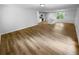 Open concept living room and kitchen with hardwood floors and lots of natural light at 355 Marietta Hwy, Roswell, GA 30075