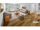 Living room featuring neutral tones, hardwood floors, and large windows providing natural light at 355 Marietta Hwy, Roswell, GA 30075