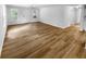 Open living room area featuring hardwood floors and windows allowing lots of natural light at 355 Marietta Hwy, Roswell, GA 30075