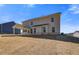 Large backyard with a covered patio offering ample space for outdoor activities and entertaining at 124 Felicity Pike, Locust Grove, GA 30248