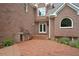 Brick backyard with a built-in outdoor kitchen and grill at 230 Summerhouse Ln, Atlanta, GA 30350