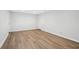 Finished basement with luxury vinyl plank flooring, neutral walls, and white trim at 230 Summerhouse Ln, Atlanta, GA 30350