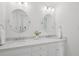 Clean and bright bathroom featuring double sinks, round mirrors, and modern fixtures at 230 Summerhouse Ln, Atlanta, GA 30350