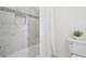 Modern bathroom featuring updated tilework and a shower-tub combo at 230 Summerhouse Ln, Atlanta, GA 30350